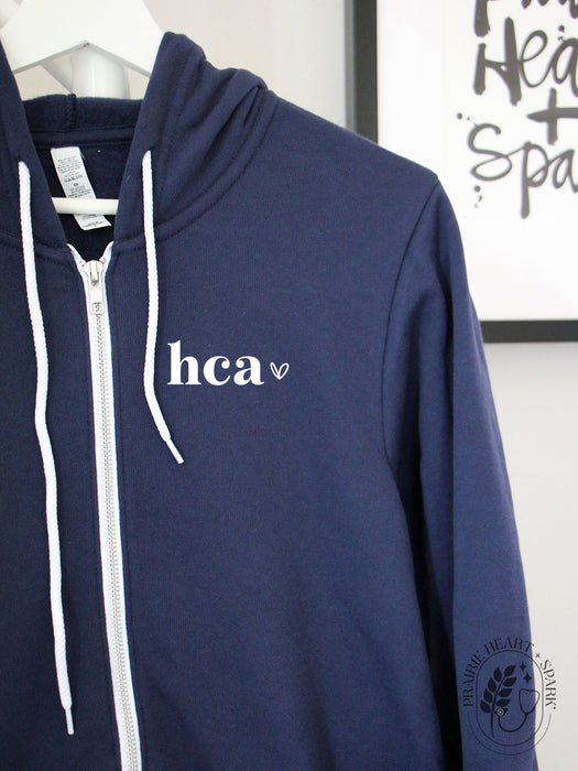 Allied Heart: HCA on a Navy zip up hoodie